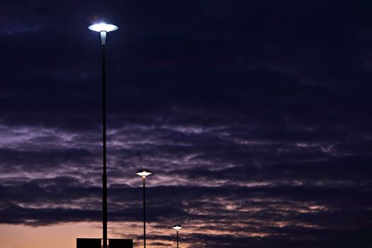 Row of street lamps at night