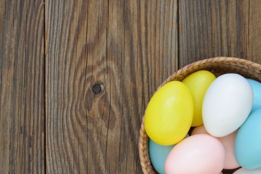 Easter eggs inside a wicker basket 
