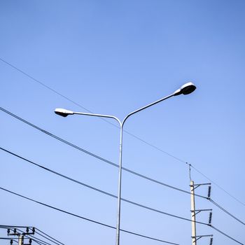 street light and Electricity post on blue sky
