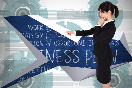 Businesswoman pointing against technology wheel background