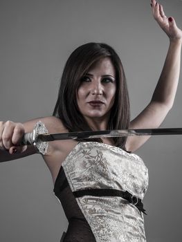 Warrior.Anime stylized brunette with short hair holding a katana sword with two hands
