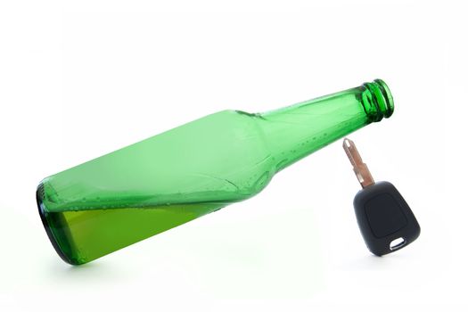 Beer bottle balanced on top of car keys 