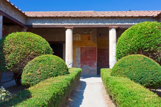 Antique roman house and garden in Pompeii, Italy.