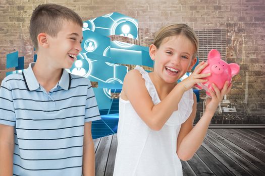 Smiling young girl holding piggy bank against city scene in a room