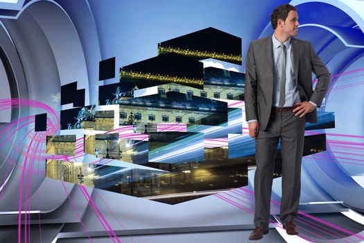 Smiling businessman with hand on hip against abstract pink design in futuristic structure