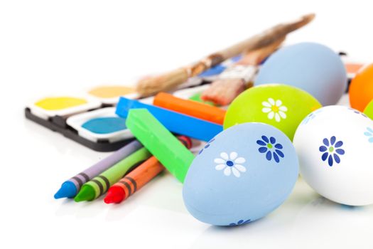 painting easter eggs on a white background.