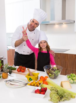 Junior chef and master teacher award winner in a cooking contest