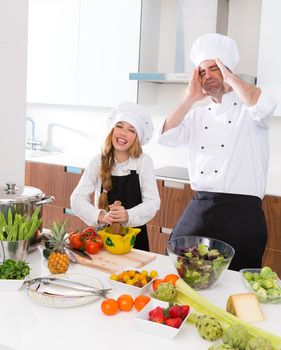 Chef master and junior kid girl at cooking school crazy man about pupil recipe