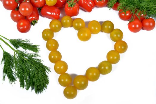 small yellow tomatoes forming a heart with red tomatoes
