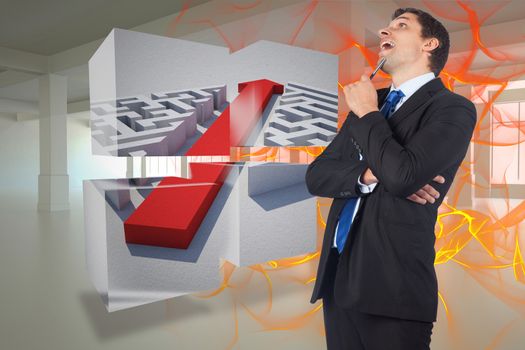 Thinking businessman holding pen against abstract design in orange