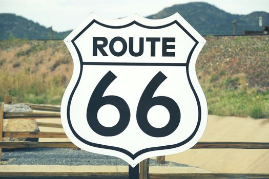 A scenic view of a historic Route 66 sign