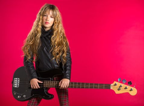 Blond Rock and roll girl bass guitar player on red background