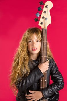 Blond Rock and roll girl bass guitar player portrait on red background