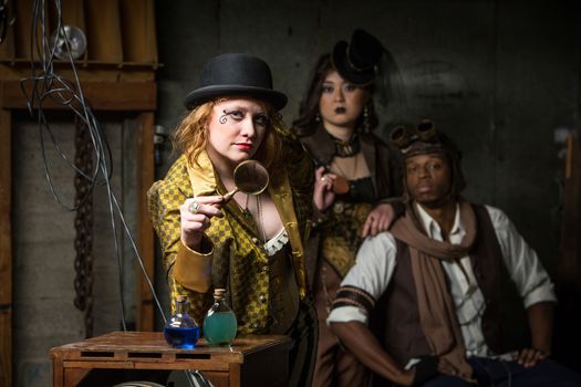 Three Steampunks with in Retro Lab with Potions