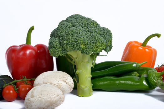 broccoli surround different seasonal vegetables isolated on a white background