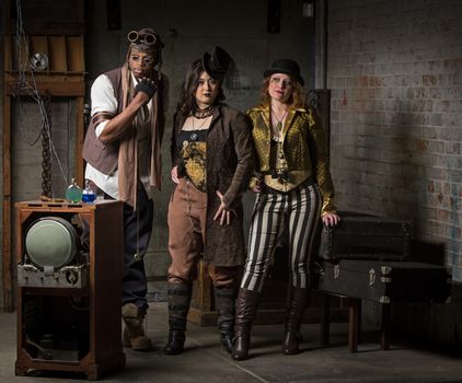 Three Young Diverse Steampunks in Retro Lair
