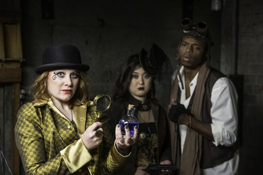 Steam Punks in Underground Lair with Potion and Magnifying Glass