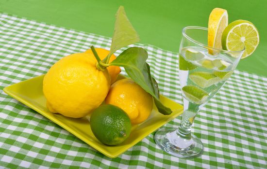 lime and lemon with glass on the white background