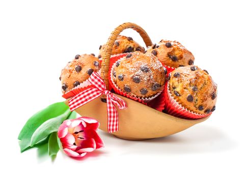 Muffins in a basket isolated on white background