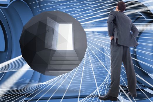 Businessman standing with hands on hips against abstract design in futuristic structure