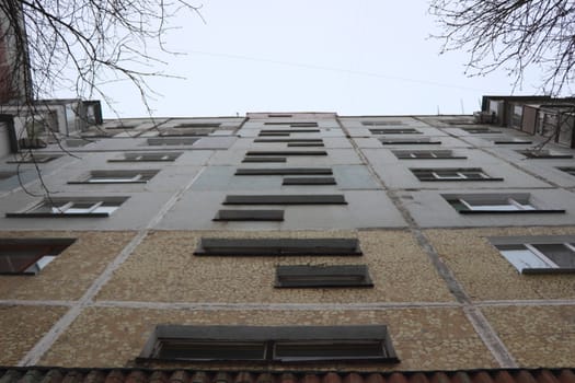 look at the sky along a multistory building