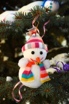 Christmas ornaments hanging on a Christmas tree snowman