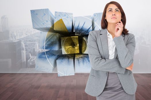 Focused businesswoman against city scene in a room