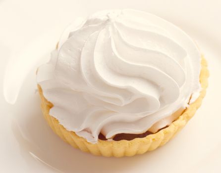 Cake with whipped cream on a plate