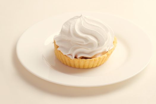 Cake with whipped cream on a plate