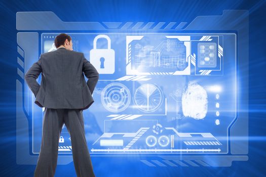 Businessman standing with hands on hips against global technology background