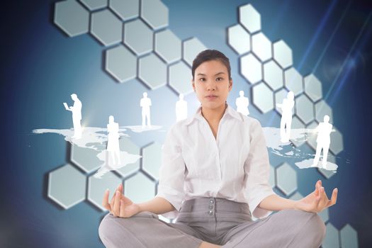 Businesswoman sitting in lotus pose against technological background with hexagons