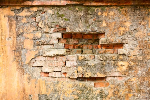 Old weathered brick wall fragment