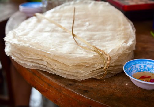 Vietnamese dry rice wafers (Banh trang or banh da nem) on a table