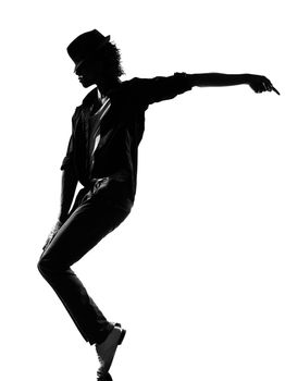 full length silhouette of a young man dancer dancing funky hip hop r&b on isolated studio white background