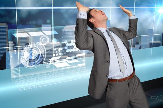 Businessman standing with arms pressing up against futuristic technology interface
