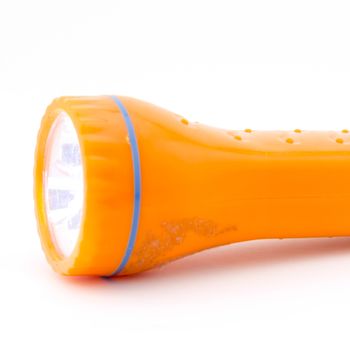 orange flashlight isolated on white background