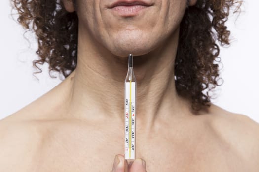 Cropped portrait of mediterranean looking man holding a mercury thermometer
