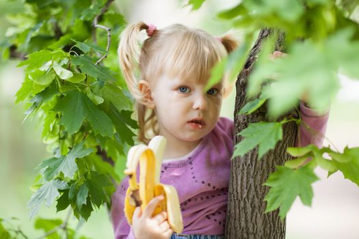 girl on the tree with banana