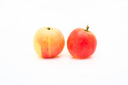 small red and yellow apples isolated on white background