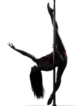 one caucasian woman pole dancer dancing in silhouette studio isolated on white background