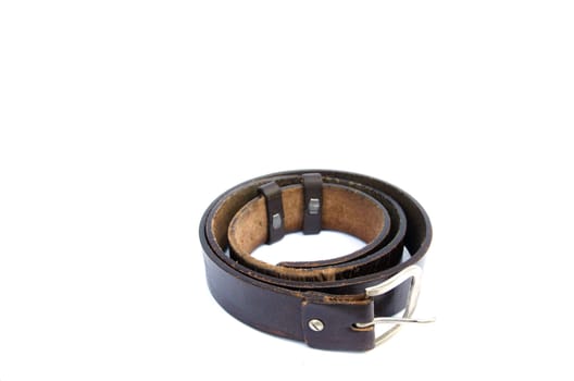 Photo of a brown leather belt for men. It is round shaped and isoalted on white background.