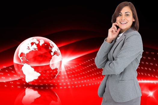 Happy businesswoman against global technology background