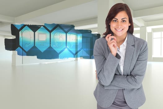 Smiling thoughtful businesswoman against abstract screen in room showing technology interface