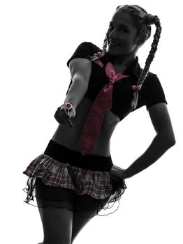 one caucasian sexy woman schoolgirl costume portrait in silhouette studio isolated on white background