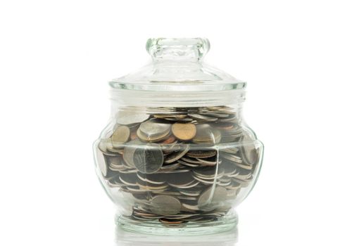 Bath coins in a glass jar with lid on white background