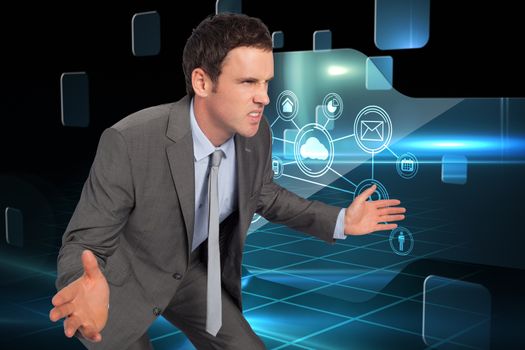 Businessman posing with hands out against futuristic technology interface
