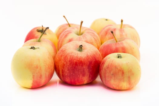 small red and yellow apples isolated on white background