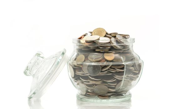 Bath coins in a glass jar with lid on white background