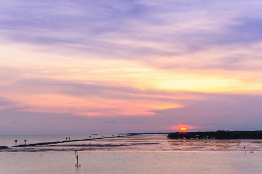 Silhouette sunset at tropical sea in Thailand.