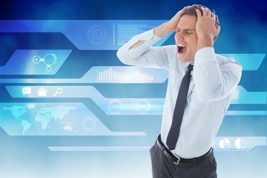 Stressed businessman with hands on head against abstract technology background